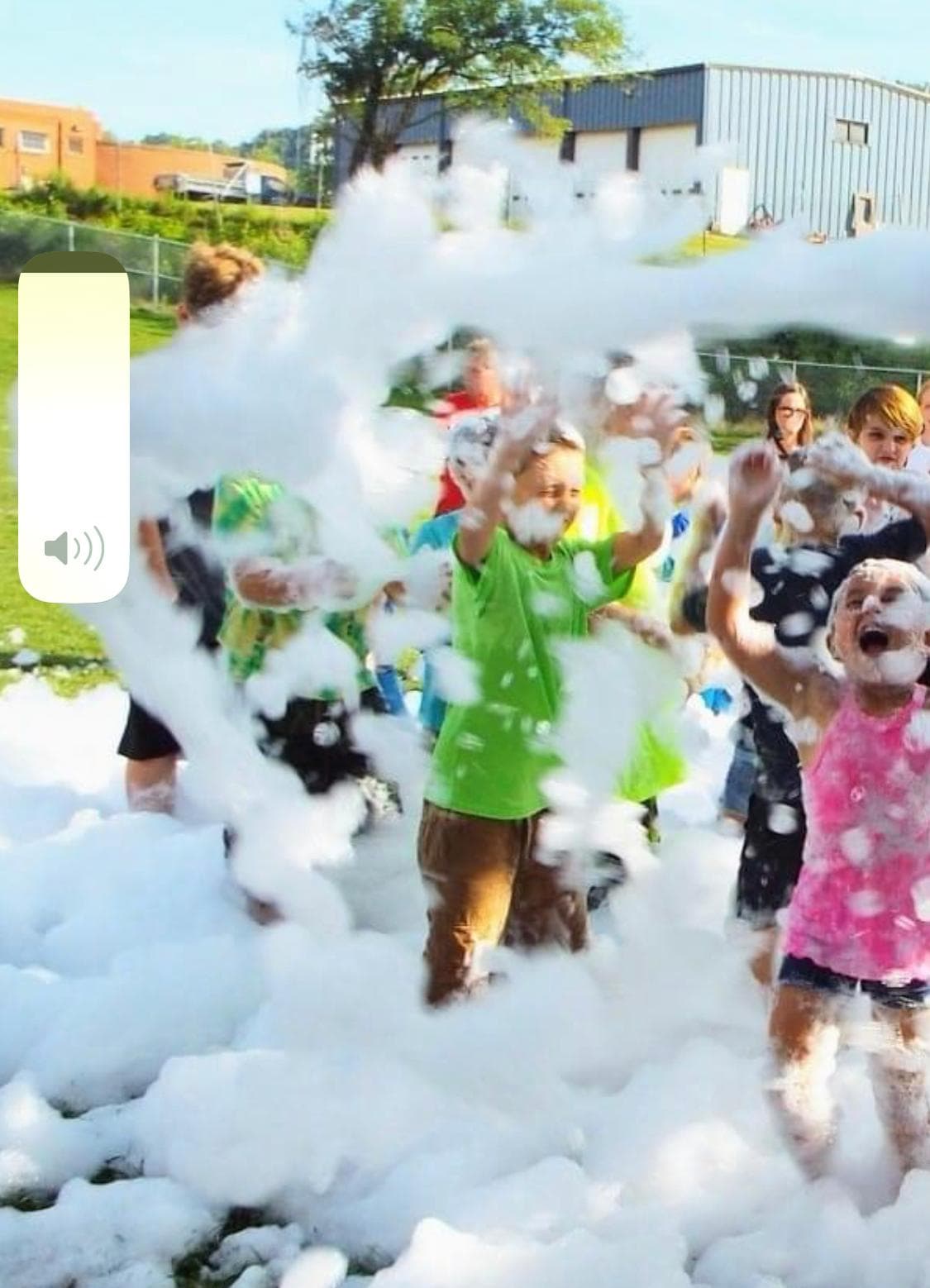 Kids playing in foam at an outdoor party