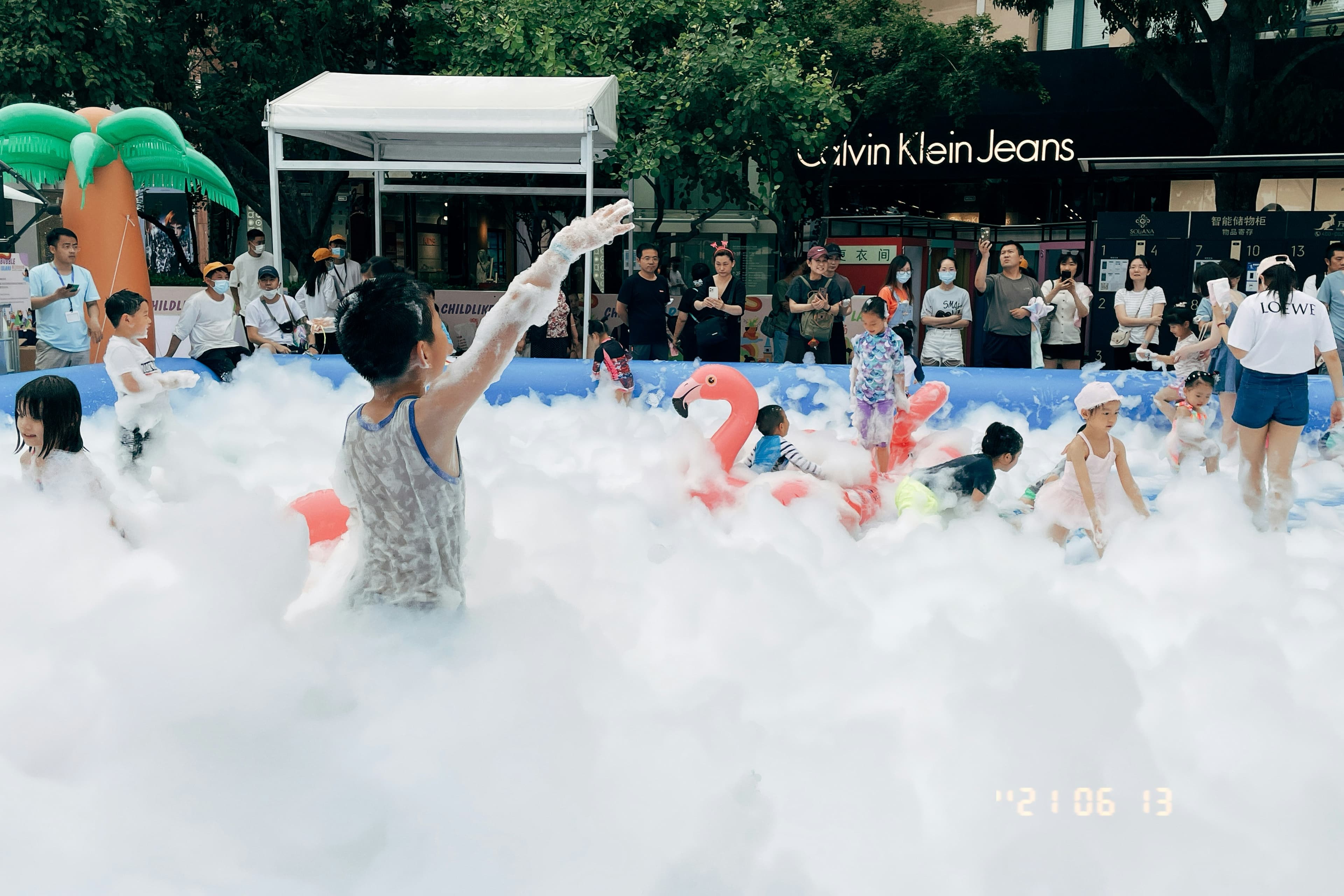 Kids foam party outdoor with flamingo float